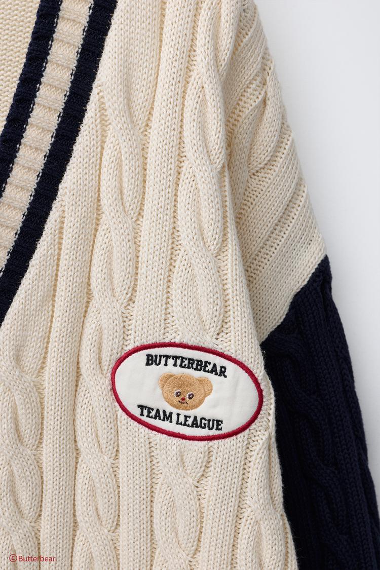 CABLE-KNIT CARDIGAN WITH BUTTERBEAR © EMBROIDERY